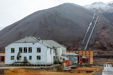 The sudden abandoned russian mining town Pyramiden, snowcaped mountain in the back, Isfjorden, Longyearbyen, Svalbard, Norway.
