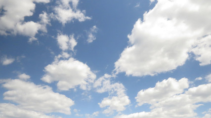 Naklejka na ściany i meble White clouds on blue sky background