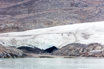 A group of hikers on Top of the glacier Nordenskiöldbreen near Pyramiden, on the coast of Billefjord, Svalbard. Norway