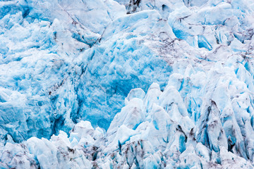 At the edge of the glacier Nordenskiöldbreen near Pyramiden, on the coast of Billefjord, Svalbard....