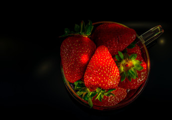 strawberries and bananas are on the table