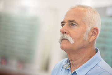 headshot of senior man looking into the distance