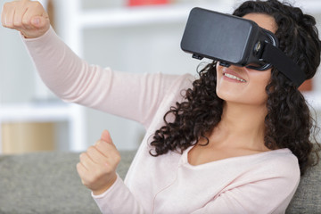 happy young woman with virtual reality headset