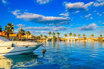 Foto op Aluminium White luxury yachts in a sea harbor of Hurghada, Egypt. Marina with tourist boats on Red Sea © ihorbondarenko
