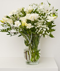 White flowers on glass vase home decoration.