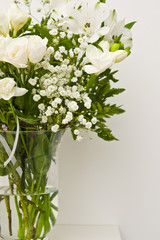 White flowers on glass vase home decoration.