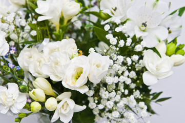 Naklejka na ściany i meble White flowers on glass vase home decoration.
