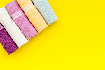 high quality cotton towels set on yellow background top view mock up