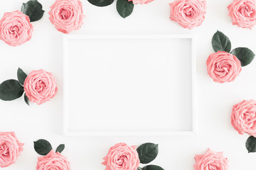 Beautiful flowers composition. Blank frame for text, pink rose flowers on white background. Valentines Day, Easter, Birthday, Happy Women's Day, Mother's day. Flat lay, top view, copy space