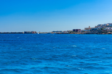 Naklejka na ściany i meble Panoramic view on Hurghada city from the Red sea
