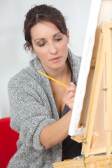 woman canvas easel