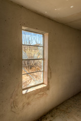 Through the broken windows of an Abandoned House.