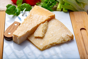 Original italian cheese, aged Parmesan cow milk cheese, pieces of Parmigiano-Reggiano