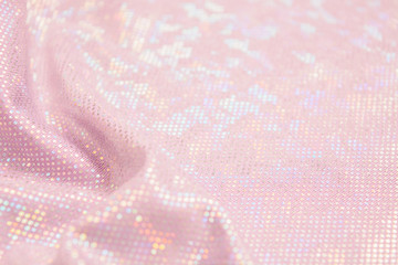 Pink holiday shiny textile material background with waves and copy space