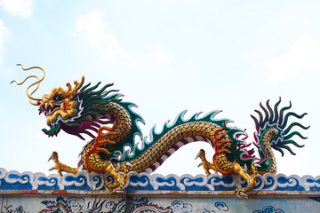 Fototapeta na wymiar Giant grand colorful Chinese dragon isolate bright natural blue sky background