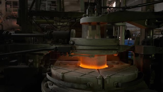 Plant for the production of glass bottles. Glass recycling. Molten glass. Furnace. Steadicam shot 4k