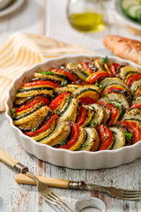 Vegetable tian, Provencal vegetable casserole, delicious and nutritious vegetarian meal - obrazy, fototapety, plakaty