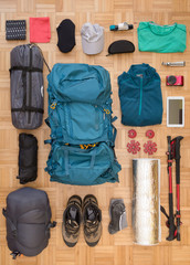 Top view and flat lay of men's camping gear and equipment