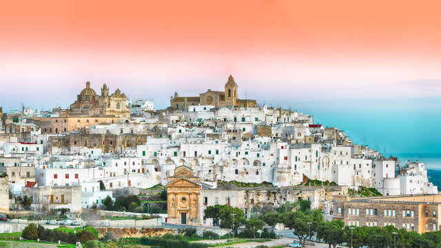 Ostuni white town skyline at sunrise