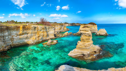 Picturesque seascape with cliffs, rocky arch at Torre Sant Andrea