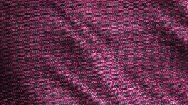 Detailed pink grey plaid cloth waving. Close up, macro shot of vintage checked, tartan background. 