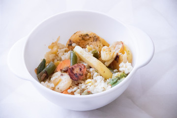 Bulgur and fried vegetables in a plate. Healthy food. Vegetables with porridge in the plate.