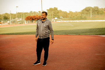 A handsome coach at the field