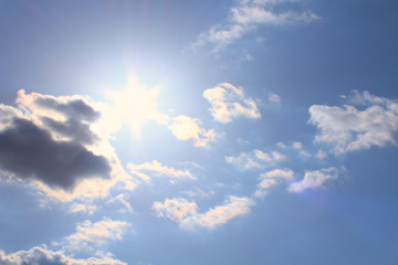 Beautiful cumulus clouds and bright real sun. Background. Landscape.