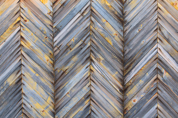 Wooden unpainted boards. Herringbone. Close-up. Background. Texture.