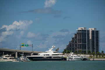 Stock photo luxury yachts in Miami by bridge