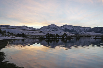 Mono Lake is one of many unique landscapes on the southern part of California. During winter season this area is most often cover in thick tule fog. You can see the low fog moving in  on the mountain 