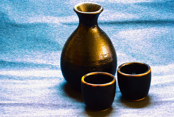 a sake set with cups and carafe