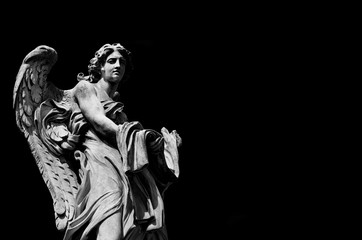 Fototapeta na wymiar Angel marble statue with garment and dice, a 17th century baroque masterpiece on Holy Angel Bridge in Rome (Black and White with copy space)