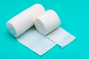 Hospital Grade Sterile Rolled Gauze on green background.