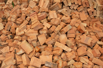 pile of bricks which is prepared for construction. red brick wall at the construction site.