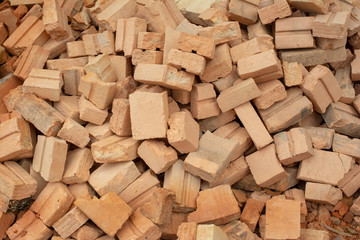 pile of bricks which is prepared for construction. red brick wall at the construction site.