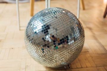 Mirror disco ball laying on the floor