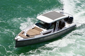Aerial close-up view of an upscale motorboat powered by two outboard engines