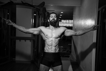 Strong mans posing in gym, bodybuilder, muscular men. Copy space. Beautiful male torso. Sexy man, naked body, nude male. Sexy body, nude man, naked male, muscled, black and white. - Image
