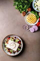 Fototapeta na wymiar Feta cheese salad in ceramic bowl