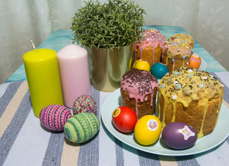 Fototapeta na wymiar Cakes with icing, eggs, multicolored