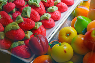 Colorful marzipan almond shaped fruit candies in an Italian pastry shop