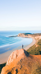 Aerial View of Beautiful Beach Coastline with Person on top of Cliffs Along the Great Ocean Road Australia - 269124910