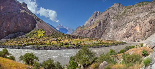 Panj River on the border of Tajikistan and Afghanistan, traveling through Central Asia. Panoramic view of the mountain landscape. 