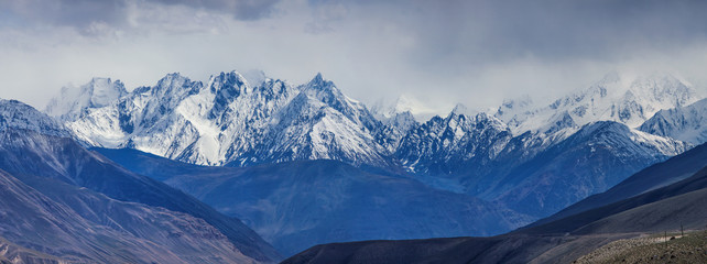 Snow-capped peaks of the Hindu-Kush Mountains. Wakhan Corridor, on the border of Tajikistan and Afghanistan.  Here passed the ancient Silk Road. Travels in Asia.
