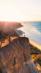 Aerial View of Beautiful Beach Coastline with Person on top of Cliffs Along the Great Ocean Road Australia - 269127752