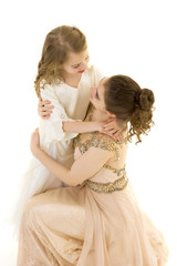 Fototapeta na wymiar A young girl hugs her little sister.