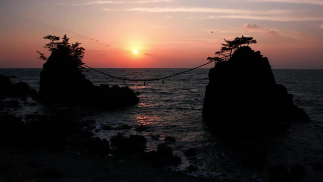 Sunset over Scenic Rocks and a Sea (w/ birds): Hatagoiwa Rocks in Noto Peninsula, Ishikawa Pref., Japan 
