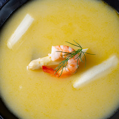 Super delicious asparagus soup with crab and capers .