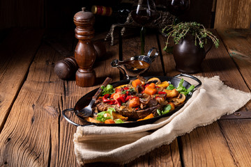 tender beef topped with various vegetables